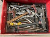 many tools in a red box on the floor