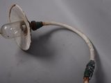 a light bulb that is attached to a wire
