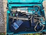 a blue box with tools in it sitting on the ground