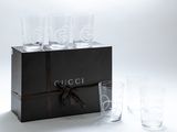 four glasses in a box with a ribbon around them