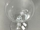 a wine glass that is sitting on a table