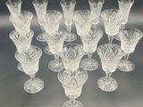 a lot of wine glasses that are sitting on a table