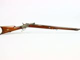 an old rifle with a wooden barrel and a wooden handle