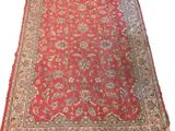 an oriental rug on a white background with a red background