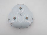 a blue and white porcelain object with flowers on it