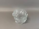 a clear glass bowl with a flower inside of it