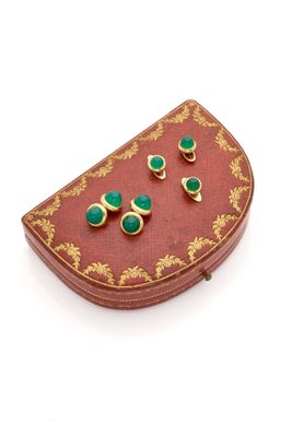an image of a pair of green earrings sitting on top of a red box