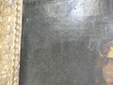 a picture of a painting of a woman in a gold frame