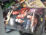 a pile of comic books sitting on a table