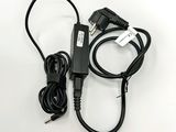 a close up of a charger and a cord on a white surface