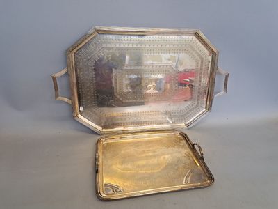a silver tray with a mirror in it on a table