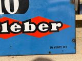 a blue sign with a red and black number 10 on it