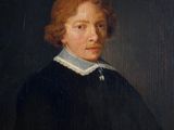 portrait of a young man in a black dress with a white collar