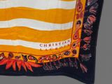 an orange and white scarf with a black border and a yellow and white stripe