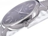 a close up of a watch on a white surface
