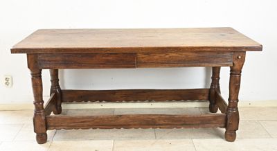 a wooden table with a drawer on top of it