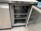 a small refrigerator with a lot of food inside of it