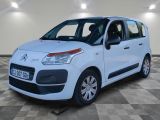 the white citrole van is parked in a large room