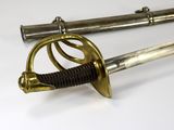 a close up of two swords on a white surface