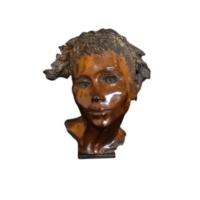 sculpture of a woman ' s head on a wooden base