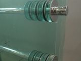 a glass display case with a pair of dumb dumbs on it