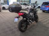 a motorcycle that is parked in a showroom