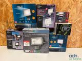 several boxes of electronic devices are stacked on top of each other