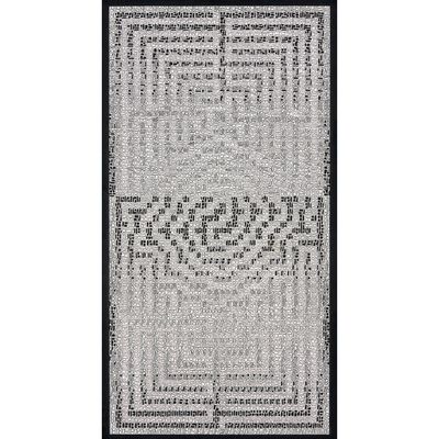 une photo en noir et blanc d'un tapis orné d'un motif