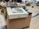 a cardboard box with a picture of a man on it in a warehouse