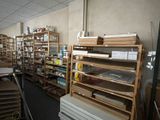 a large room with many shelves and boxes on the floor