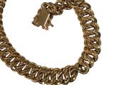 a close up of a gold chain bracelet with a lock on it