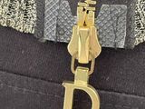 a gold zipper with a letter d on it