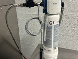 an image of a water filtrator on a stainless steel table