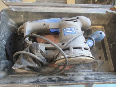 a tool in a tool box with a cord in it