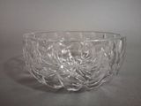 a glass bowl that is sitting on a table