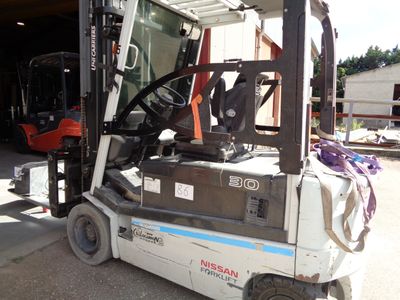 a fork lift truck parked in front of a building