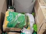 a box full of gardening supplies and a bucket full of plants