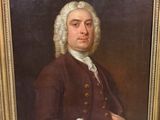 portrait of a gentleman in a brown coat with a bird on his shoulder