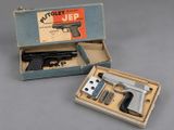an open box with a gun inside of it sitting on a table