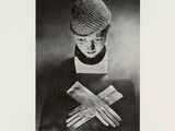 black and white photograph of a mannequin with gloves and a hat