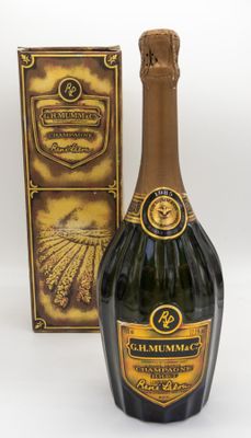 an image of a bottle of champagne next to a box of chocolate
