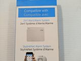 someone is holding a smart phone in their hand in front of a box