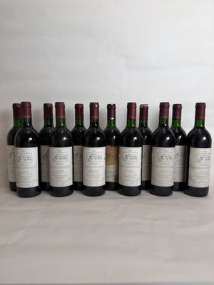 six bottles of wine are lined up in a row on a table