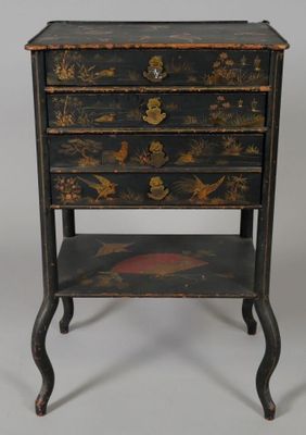 an image of a small black and gold chest of drawers
