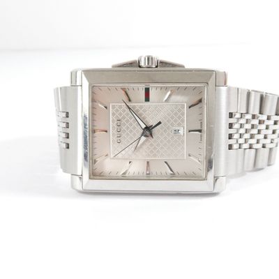 an image of a close up of a wrist watch on a white surface