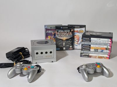 several video game controllers sitting next to each other on a table