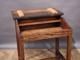 an image of a wooden desk with a laptop on top of it