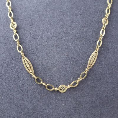 a gold plated necklace with oval links and oval links