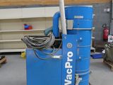 a blue machine that is sitting in a garage