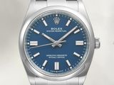 the blue dials of a rolex watch are displayed against a white background
